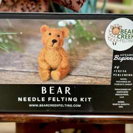 Bear needle felting kit box with a small felt bear pictured on the front