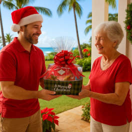 Festive Christmas gift basket with red bow being handed between two people outdoors