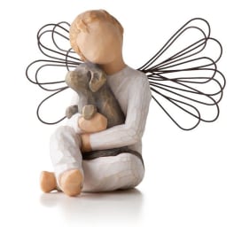 Figurine of an angel holding a dog