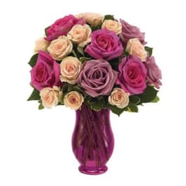 Bouquet of pink and lavender roses in a purple vase