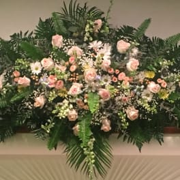 Large pink rose and daisy floral spray with greenery