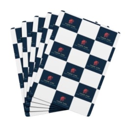 Stack of navy and white checkered floral wrapping sheets with a logo print