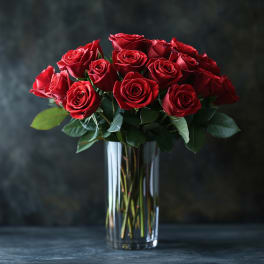 Bouquet of red roses in a clear glass vase