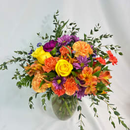Colorful mixed bouquet in a clear glass vase