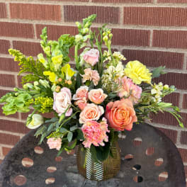 Mixed pastel bouquet in a ribbed glass vase