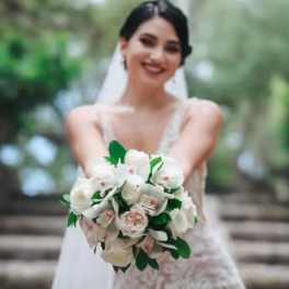 Bride holding a white and blush wedding bouquet