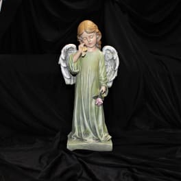 Angel statue holding a pink rose
