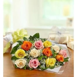 Bouquet of multicolored roses wrapped in clear paper