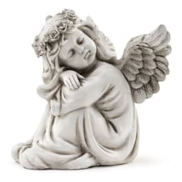 Stone angel figurine with flower crown and wings
