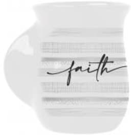 White round decorative object with the word "faith" in black script