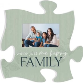 Puzzle-piece photo frame with a family picture and the words "we're just one happy FAMILY"