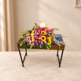 Bright mixed flower arrangement on a wooden table