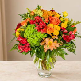 Colorful mixed bouquet in a clear glass vase