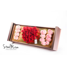 Rectangular box of red and pink roses arranged in sections