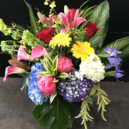Colorful bouquet with lilies, roses, hydrangeas, and gerbera daisies