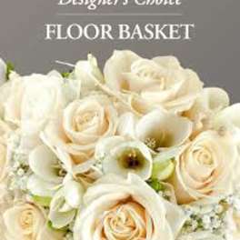 Cream roses and white calla lilies in a floor basket