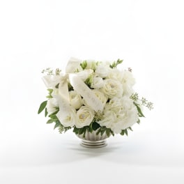 White rose bouquet in a silver vase with cream ribbons