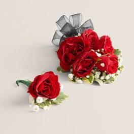 Red rose boutonniere and matching wrist corsage with black ribbon