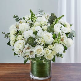 White rose bouquet in a clear glass vase