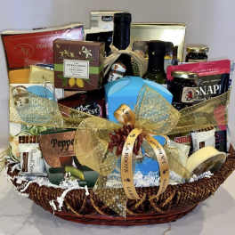 Gift basket with assorted gourmet foods and a gold ribbon