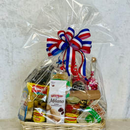 Gift basket with assorted snacks and chocolates wrapped in clear cellophane