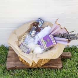 Gift basket with lavender-wrapped items and dried flowers
