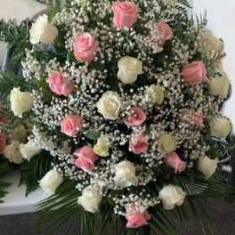 Large bouquet of pink and white roses with baby's breath