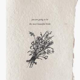 Cream card with the words "you are going to be the most beautiful bride" and a floral sketch