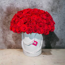 Large bouquet of red roses in a white hat box