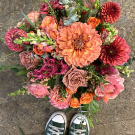 Colorful mixed bouquet with dahlias, roses, and pink blooms