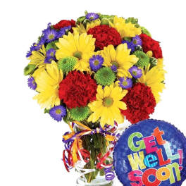 Bouquet of yellow, red, and purple flowers in a glass vase with a Get Well Soon balloon