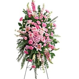 Tall pink floral standing spray on an easel