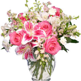Pink and white mixed bouquet in a clear glass vase