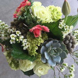 Bouquet with white roses, pink tulips, and a succulent accent