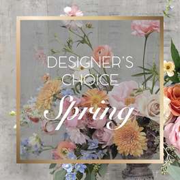 Pastel spring floral arrangement with roses, dahlias, and blue flowers