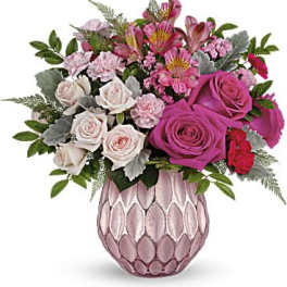 Pink and white mixed bouquet in a pink textured vase