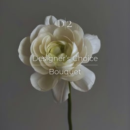 Single white flower labeled Designer's Choice Bouquet