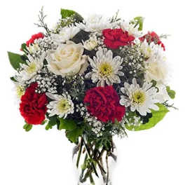 Bouquet of red and white flowers in a clear glass vase