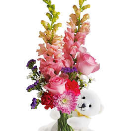 Pink and purple flower bouquet with a white teddy bear
