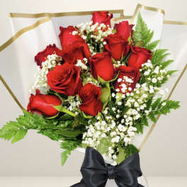 Bouquet of red roses with white baby's breath and a black ribbon