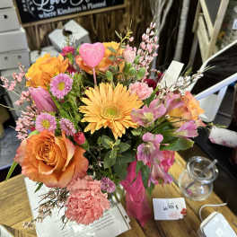 Colorful mixed bouquet with orange roses and yellow gerbera daisies