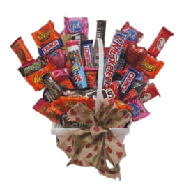 Candy bouquet in a white container with a heart-patterned bow