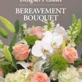 Mixed bouquet with white orchids, peach roses, and pale blooms