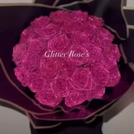 Large bouquet of red roses wrapped in white paper