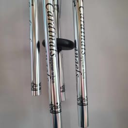 Silver wind chimes with black decorative text and scrollwork
