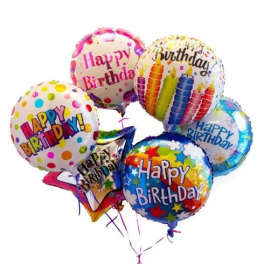 Cluster of colorful birthday balloons with printed messages