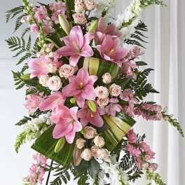 Tall pink and white floral standing spray on an easel