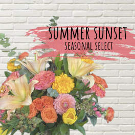 Mixed bouquet with lilies, roses, and bright seasonal blooms