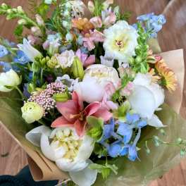 Hand-tied bouquet of pastel flowers with lilies and peonies