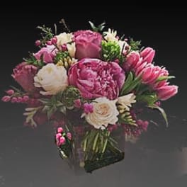Pink and white bouquet in a clear glass vase